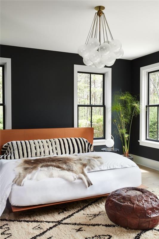 suaugusiųjų miegamasis modernus deko bohemiškas prašmatnus stilius su juodomis sienomis ir baltomis lubomis, didelė lova su rudu rėmu