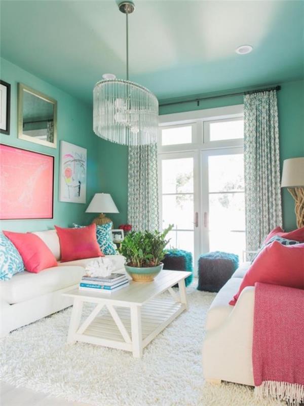 Vandens žalios gyvenamojo kambario modelis, Celadon žali sienų dažai, baltas kilimas ir baltas kavos staliukas, baltos sofos ir rožinės, mėlynos ir baltos pagalvėlės, elegantiška liustra