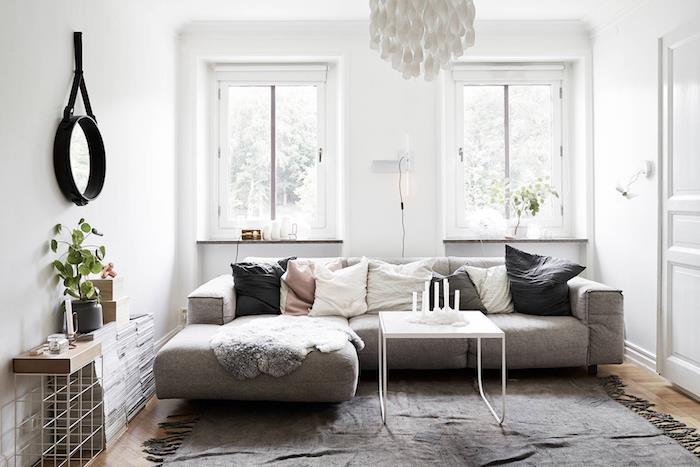 majhna dnevna soba v skandinavskem slogu nordijski slog bela in siva