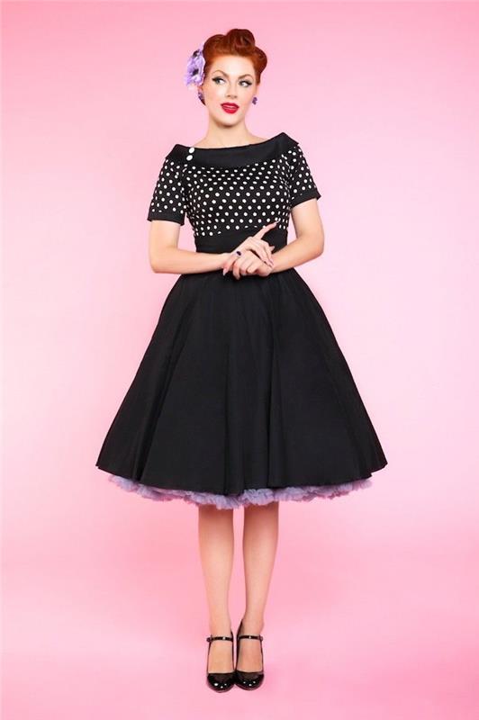 Roza ozadje, črna obleka z belimi pikami, pin-up iz 1950-ih, povojna moda, način življenja sredi 20. stoletja