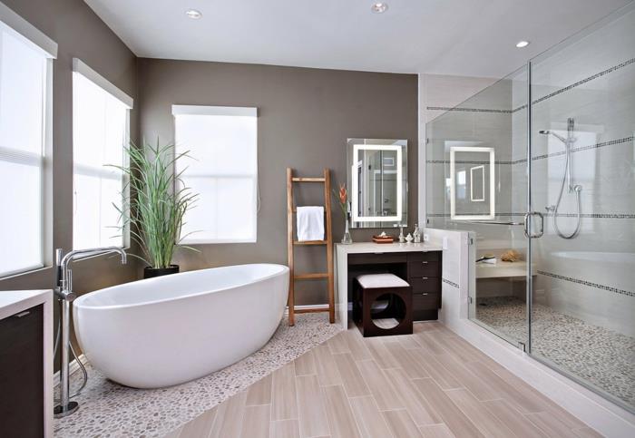 pinterest banyo, banyo bitkisi, beyaz küvet, açık bej renkli pvc parke, küçük beyaz ve kahverengi çakıl taşlarını taklit eden mozaik kaplı zeminli geniş İtalyan duşu