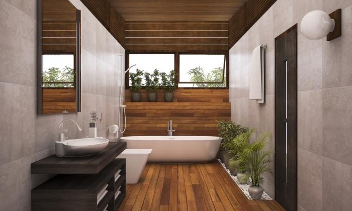 kopalniška omara iz temnega lesa, stenska obloga iz bež ploščic z rjavo leseno ploščo, zelene rastline za sproščujoče vzdušje