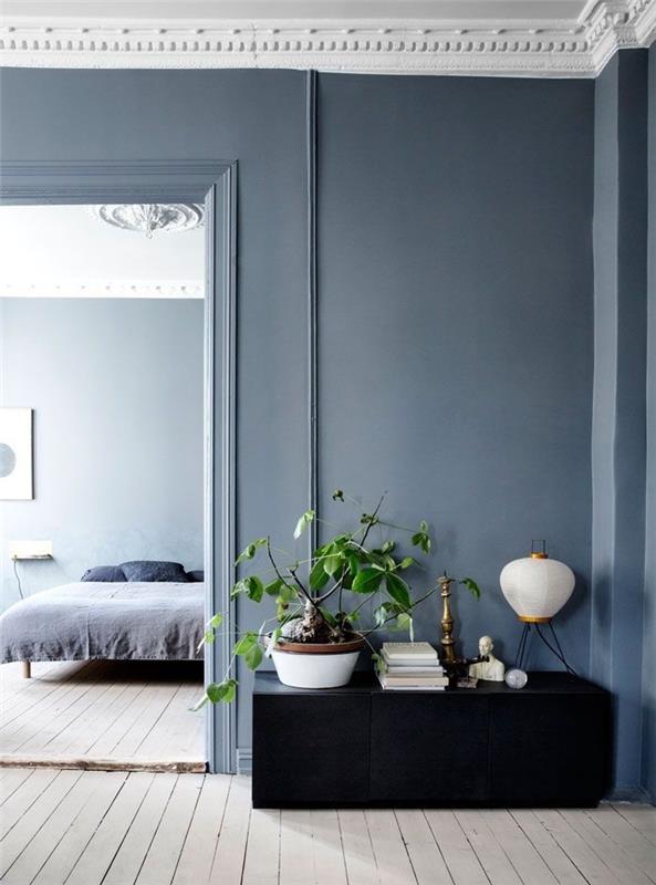 Notranjost v barvi Grege, moderna nordijska notranjost v sivo -beli barvi, dnevna soba, ki daje spalnici zelene rastline