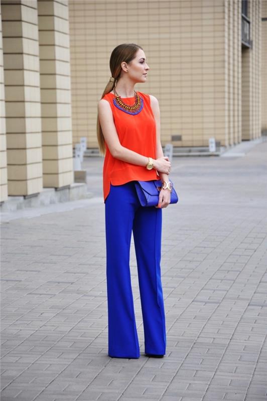 barve, ki se ujemajo z oblačenjem, kako se ujemati z dopolnilnima barvama modra in oranžna, ženska s temno modrimi hlačami in oranžnim vrhom