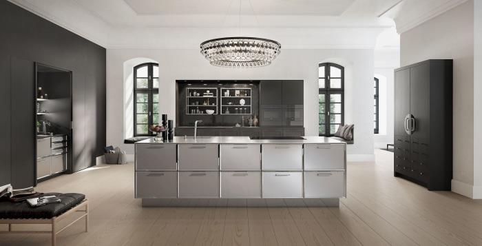 merkezi adalı açık mutfak tasarımı, mat siyah saklama dolapları ile beyaz duvarlı modern mutfak düzeni