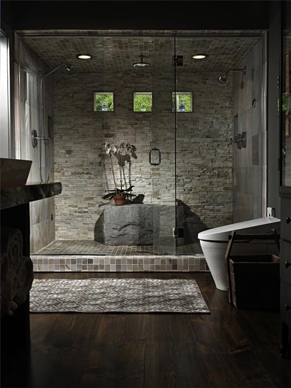 kaip sutvarkyti „zen“ vonios kambarį tamsiomis spalvomis, vonios idėja su dušo kabina su akmeninėmis sienomis