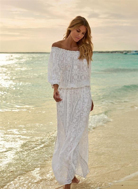 model dolge obleke z dolgimi rokavi in ​​golimi rameni z vezenjem, ideja ženskih oblačil za na plažo