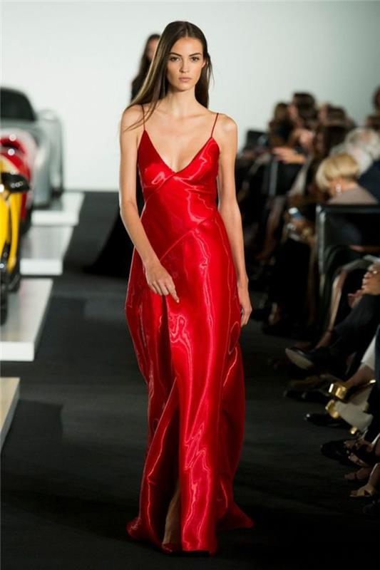 ženska slovesna obleka v rdeči barvi z zelo globokim razrezom in izrezljanim izrezom s kovinskim zaključkom