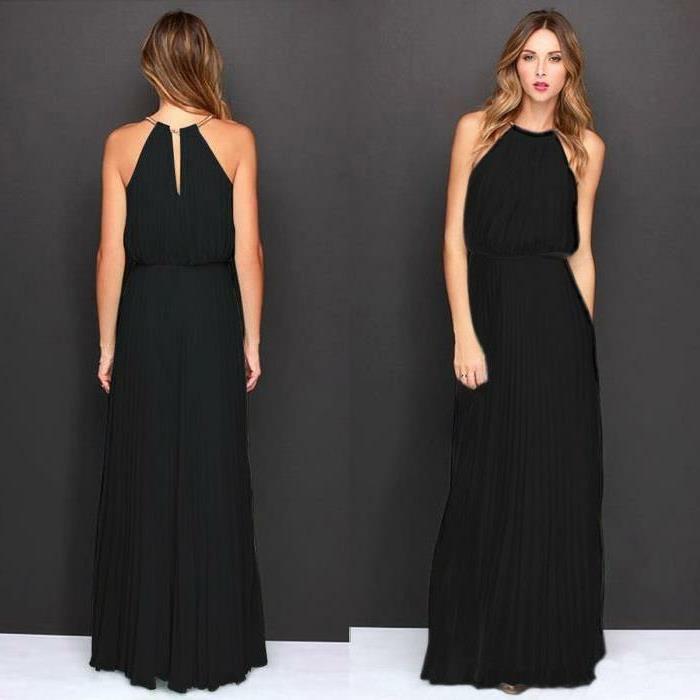 tekanti suknelė, graži juoda suknelė, banguota šukuosena, juodas klostuotas sijonas, originalus viršus