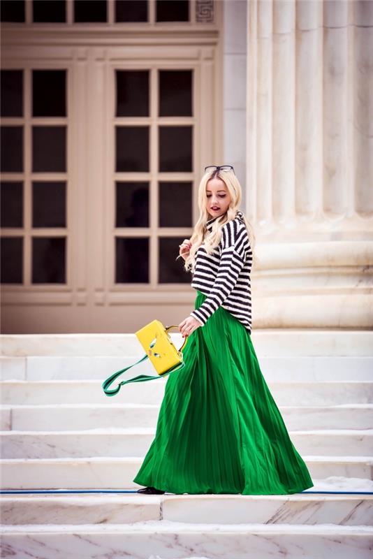 elegantna ženska obleka, model z dolgim ​​fluidnim zelenim krilom z nagubanim dizajnom in visokim pasom, zimska ženska obleka