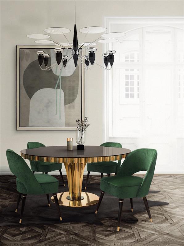 popolna sodobna jedilnica v retro slogu z okroglo zlato mizo in zelenimi žametnimi naslanjači na lesenem parketu