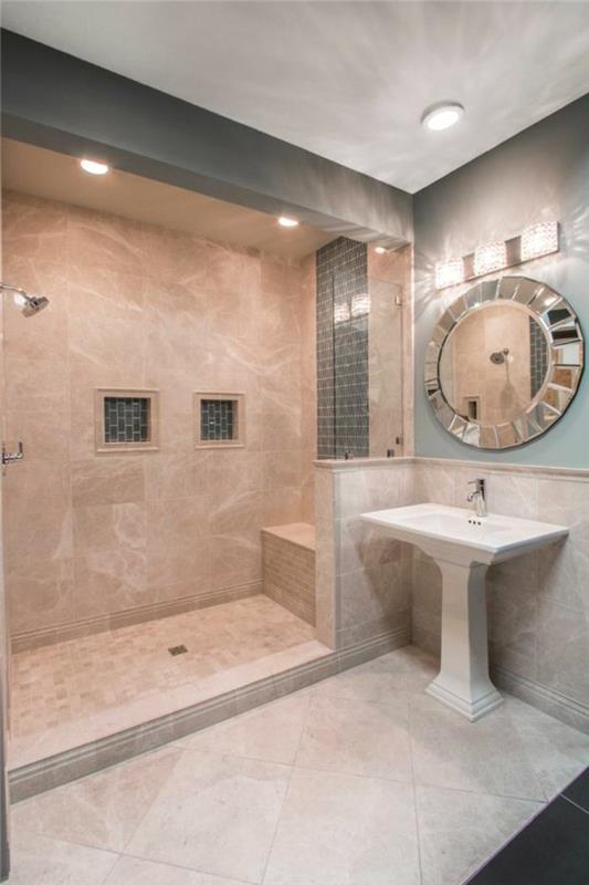 vonios kambarys-smėlio spalvos-apvalus-veidrodis-dekoratyvinis-pjedestalo-kriauklė