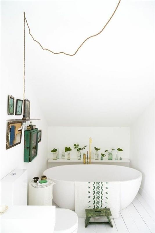 baltas-vonios kambarys-baltas-ovalus-vonia-vonia-po nuolydžiu-plytelėmis-vonios kambarys-baltas-vonios kambarys