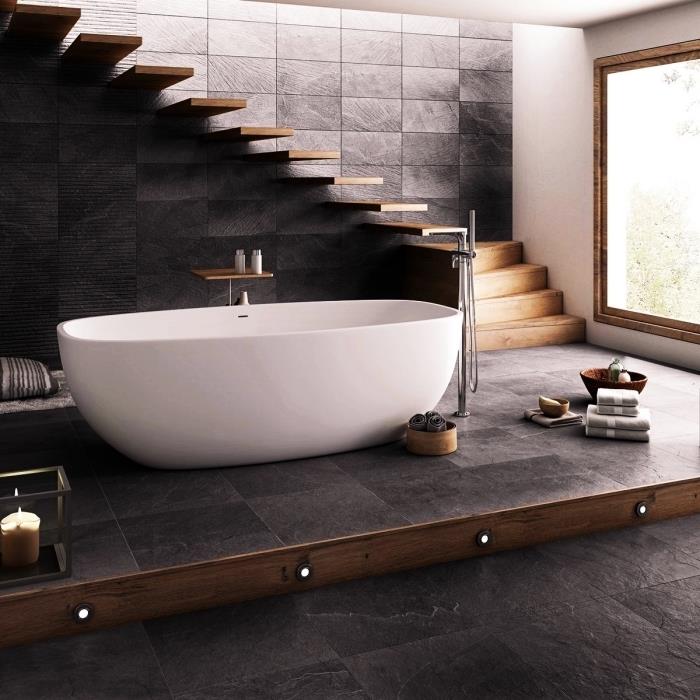 šiuolaikiško dizaino vonios kambario idėja antracito pilka ir medinė, laisvai stovintis vonios modelis iš balto ir nerūdijančio plieno maišytuvo