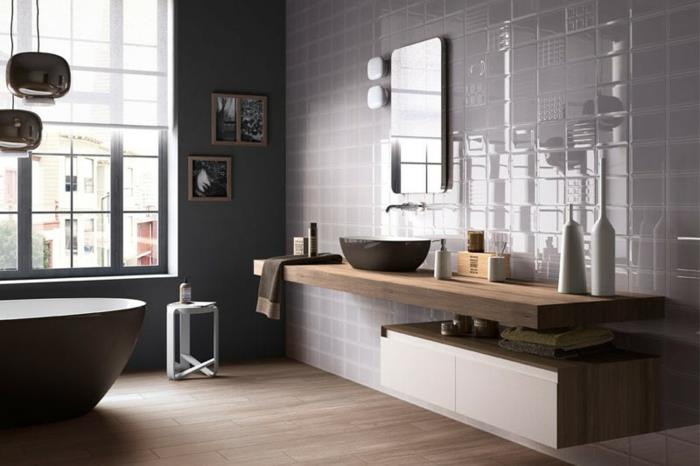 gri ve ahşap banyo, oval küvet, zıt malzemelerin minimalist ve karışık kullanımı