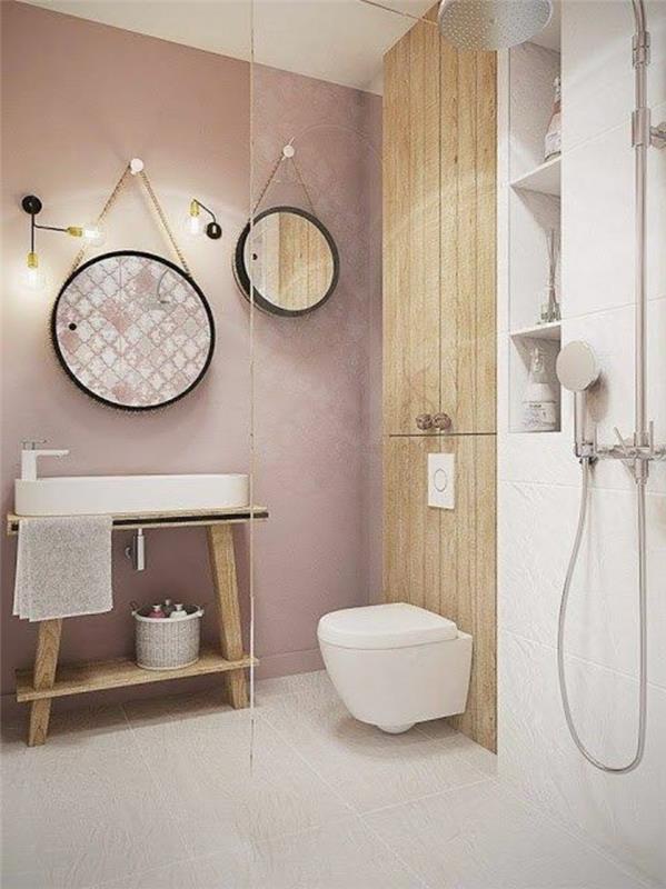 šviesiai rožinis vonios kambarys-apvalus veidrodis-grindys-smėlio spalvos plytelės-dizainas-siena-rožinė šviesa