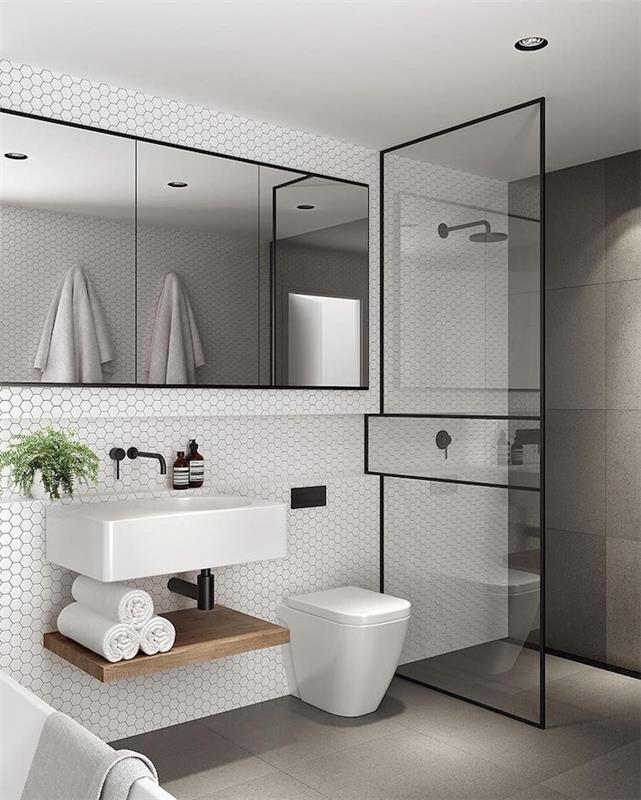 oblikovanje kopalnice oblikovanje majhnega prostora s tušem s stenskimi ploščicami velika steklena vrata in umivalnik sodobnega skandinavskega tipa