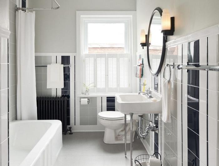 seno stiliaus vonios kambarys su vonia baltos užuolaidos kriauklė ant metalinių kojų juodos apvalios veidrodžio juodos plytelės