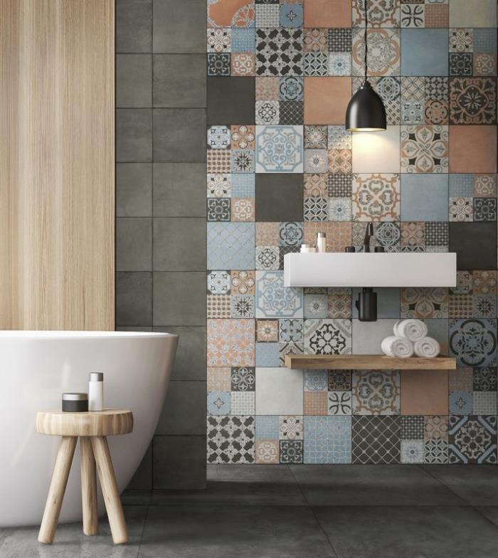 „Zen“ vonios kambaryje už natūralios medienos akcentų dedamos uždaras cemento plytelės, esančios už pakabinamo tuštybės viršaus