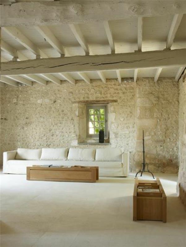 balta svetainė su akmens sienų apmušalu-baltas interjeras ir baltos plytelės