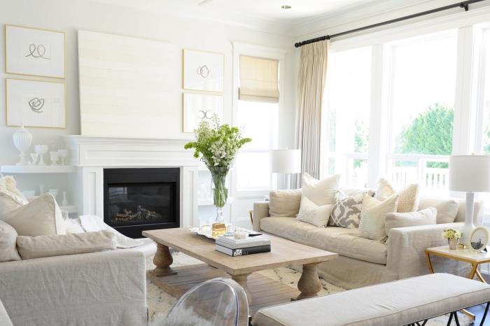 beyaz, bej ve gri desenli modern oturma odası dekor fikri, açık renkli ahşap sehpa, beyaz şömine, kabarık beyaz halı