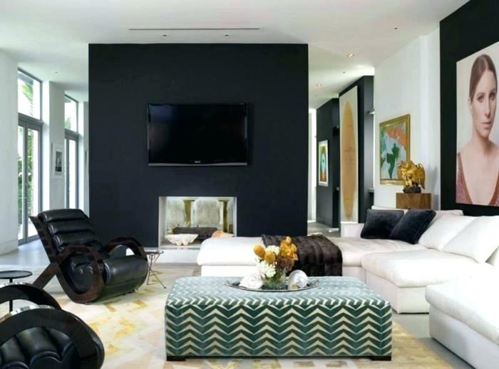 papuošti didelę sienos dalį nuotraukomis ir paveikslais, juodą sieną, jaukius odinius fotelius, sieninį televizorių