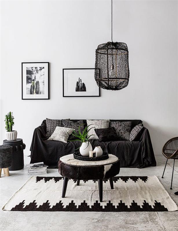 İskandinav dekorunu şık etnik vurgularla birleştiren siyah beyaz zarif oturma odası