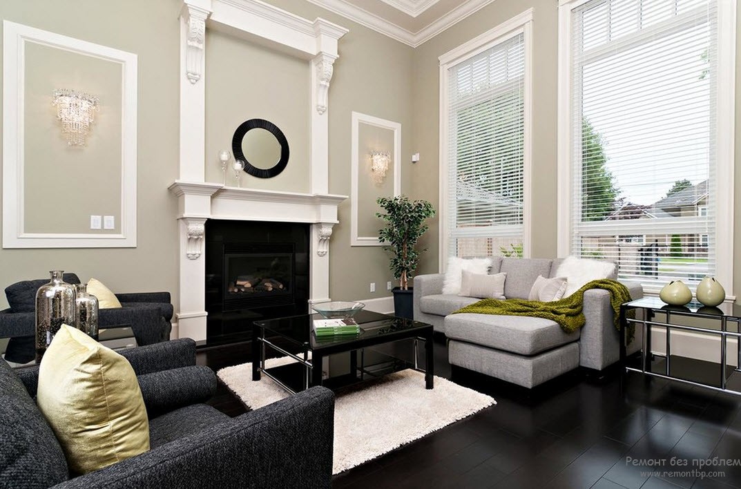Diseño de sala de estar gris combinado con colores blanco y negro.