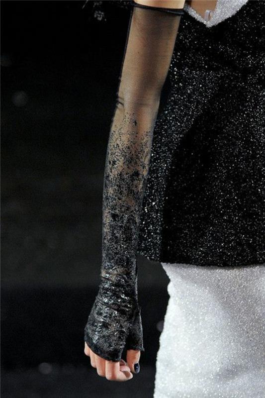 črna bluza s prozornimi rokavi in ​​majhnimi črnimi kamni, elegantna obleka s šok detajli, dolgo belo krilo z belimi kristali