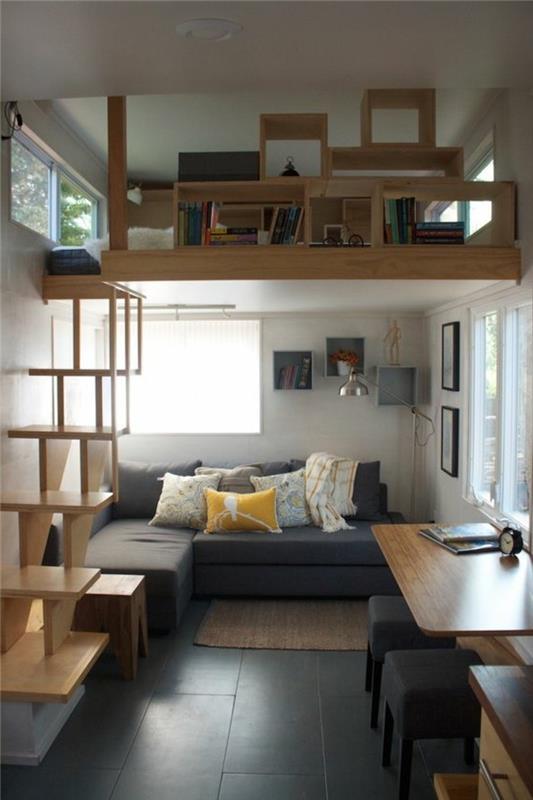 tla-v-črni-ploščici-moderna-in-elegantna-dnevna soba-siva-kotna-kavč-veliko okno