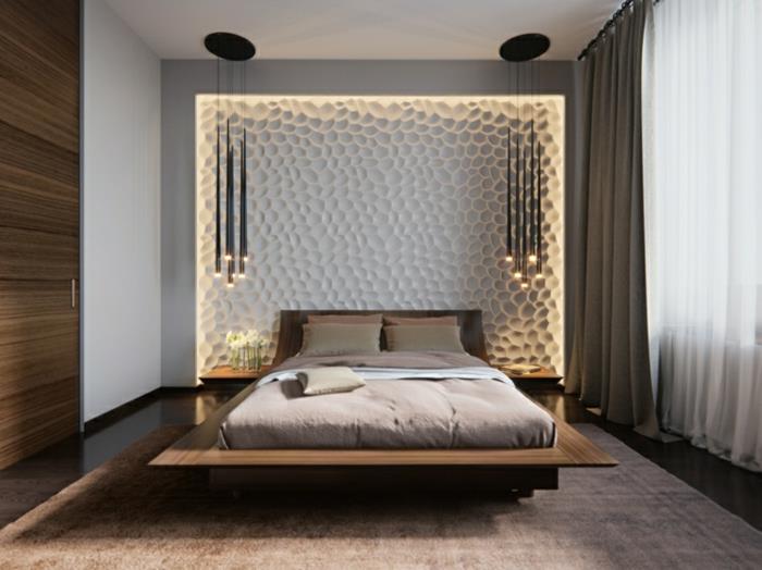 çağdaş tasarımlı bir yatak odası, yüzer yatak ve dekoratif duvar paneli, sarkıt lamba