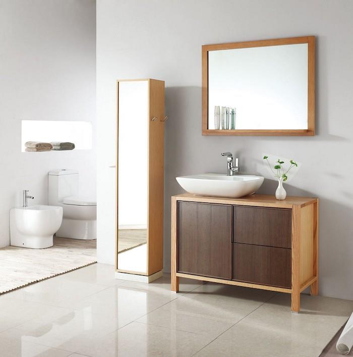 Sodobna soba z umivalnikom, omaro za shranjevanje, stranišče, moderna lesena in bela kopalnica v skandinavskem slogu