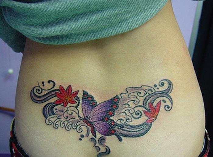 Tatuiruotė moteris apatinės nugaros spygliai spalvos tatuiruotės gėlės