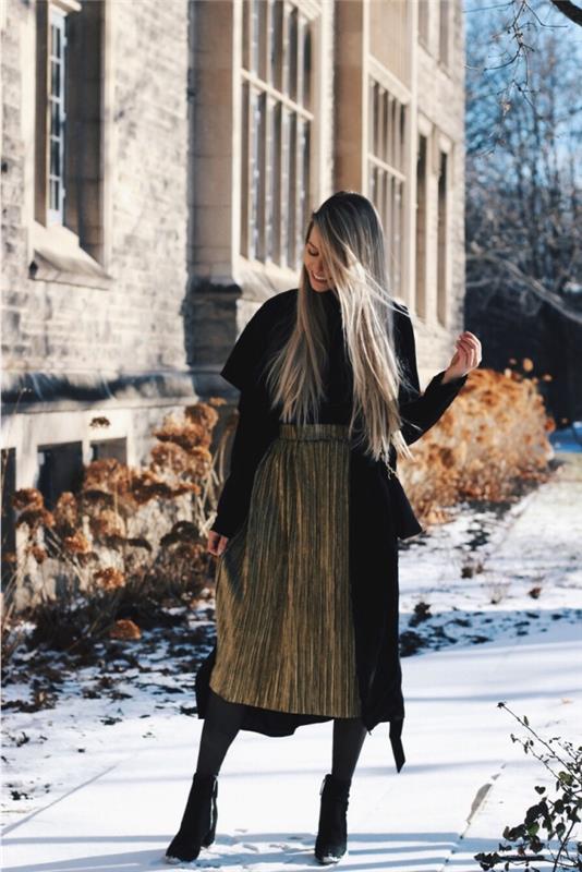 eleganten ženski videz v nagubanem midi krilu s kovinskim učinkom, model dolgega črnega ženskega plašča, lahka ideja zimske obleke