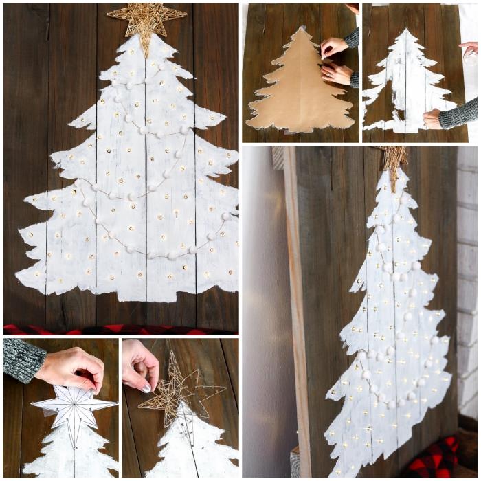 Beyaza boyanmış ve hafif bir çelenkle süslenmiş geri dönüştürülmüş bir paletten kendin yap ahşap Noel ağacı
