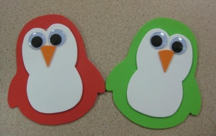 DIY za vašo sobo, dva pingvina iz rdeče in zelene klobučevine, okrašena z belimi in oranžnimi detajli iz filca in se lepijo na oči
