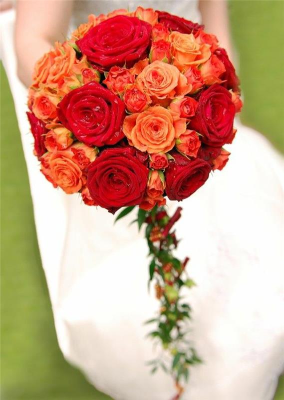 a-pretty-wedding-bouquet-of-orange-flowers-white-poročna obleka-za-poročni dan