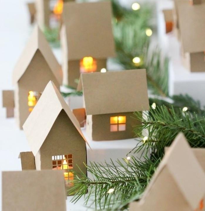 a-büyüleyici-küçük-köy-karın-kıskacı-altında-küçük-karton-evler-fantastik-Noel-dekorasyonu-yapmak