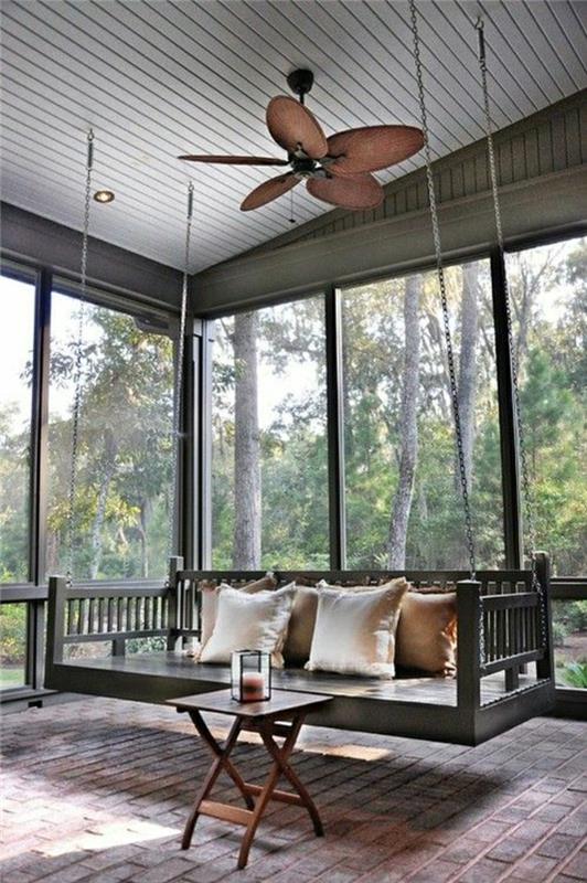 ventilatorsko oblikovanje-lestenec-zunanjost-veranda-lesena-miza-nizka opečna tla