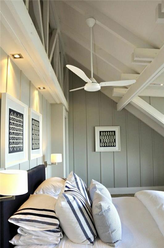 stropni dizajn-ventilator-nenavaden-lestenec-sivo-lesene-stene-elegantne-posteljnina-blazine