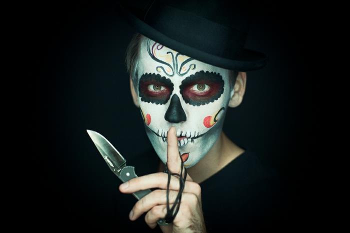 popüler cadılar bayramı makyajı, meksika şeker kafatası, bıçak tutan bir adam ve kafatası makyajı